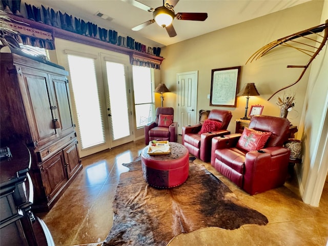 interior space featuring french doors, visible vents, and ceiling fan