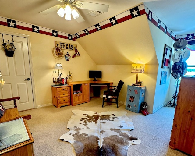 office featuring light carpet, vaulted ceiling, visible vents, and baseboards