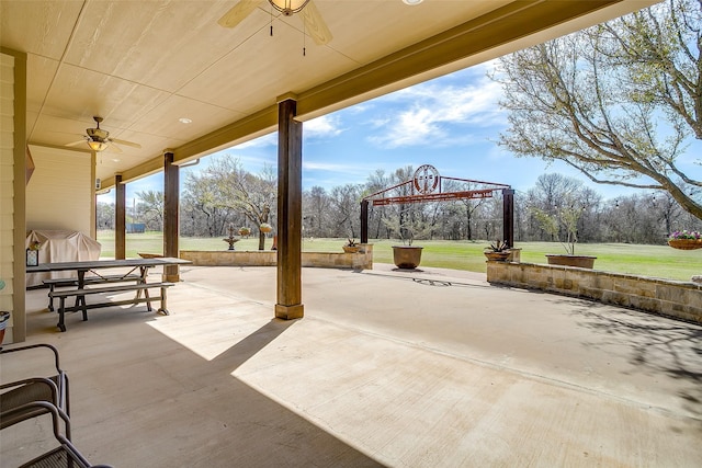 view of patio featuring ceiling fan