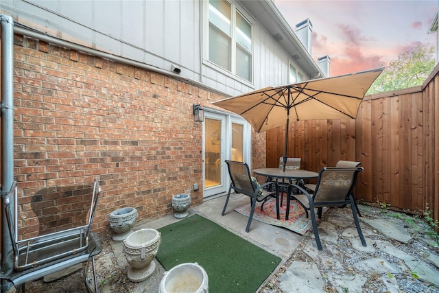 view of patio featuring fence