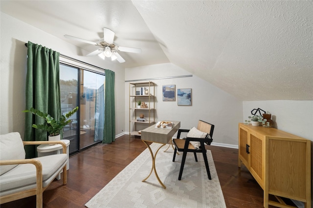 office space with a textured ceiling, baseboards, dark wood finished floors, and lofted ceiling