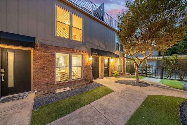 exterior space with brick siding