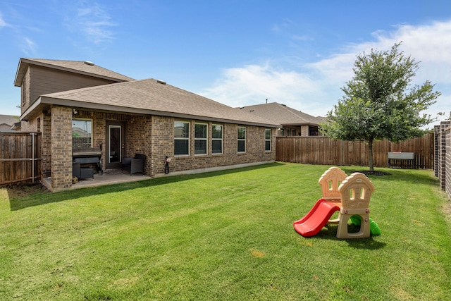 4137 Agatha Ln, Celina, TX 76227 - rear view of property with a shingled roof, a patio, and brick siding