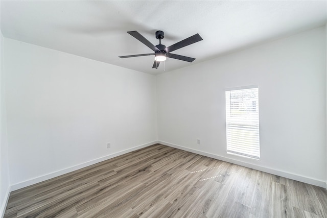 6305 Pine St, Rowlett, TX 75089 - spare room with light wood-style flooring, baseboards, and a ceiling fan