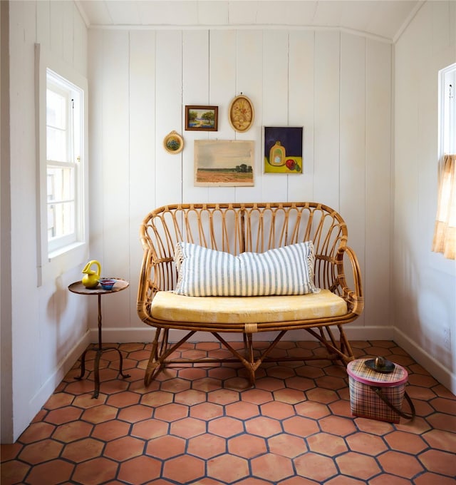 sitting room with tile patterned flooring and baseboards