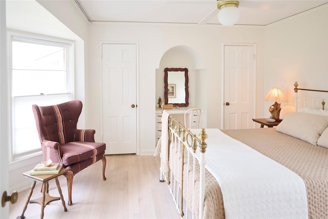 bedroom featuring light wood-type flooring and multiple windows