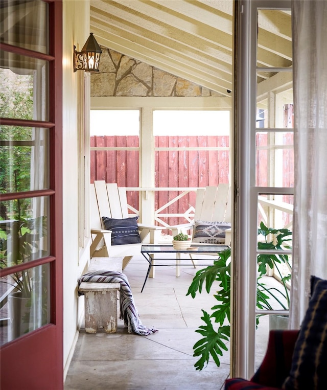 sunroom with lofted ceiling