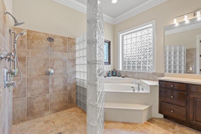 full bath with decorative columns, ornamental molding, a tile shower, a bath, and vanity