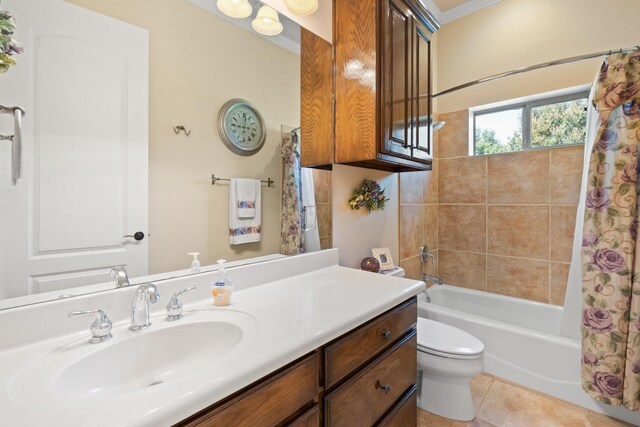 bathroom featuring shower / bath combination with curtain, tile patterned flooring, vanity, and toilet
