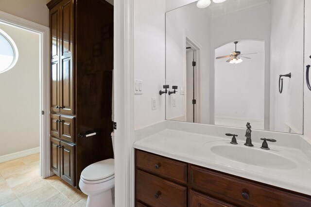 bathroom featuring ceiling fan, vanity, and toilet