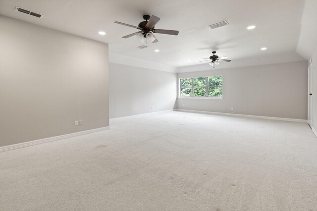 unfurnished room featuring recessed lighting, a ceiling fan, baseboards, and light colored carpet