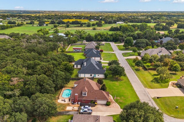 aerial perspective of suburban area featuring a pool