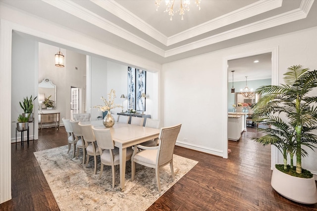 dining space with a chandelier, crown molding, baseboards, and dark wood-style floors