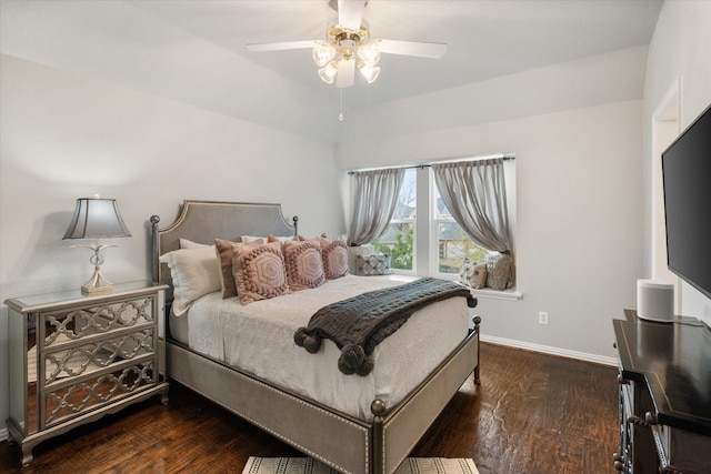 bedroom featuring ceiling fan, wood finished floors, and baseboards