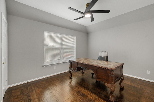 home office featuring lofted ceiling, ceiling fan, baseboards, and wood finished floors