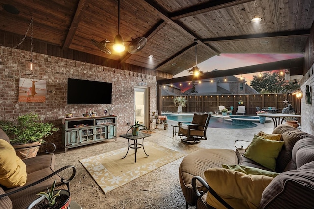 living area featuring brick wall, wooden ceiling, and beam ceiling