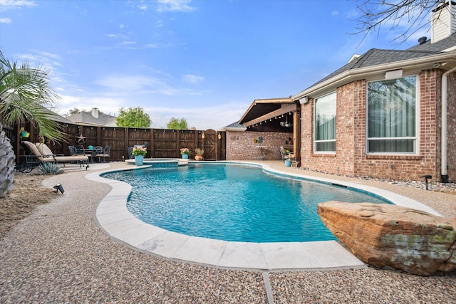 view of pool featuring a patio area, a fenced backyard, and a fenced in pool