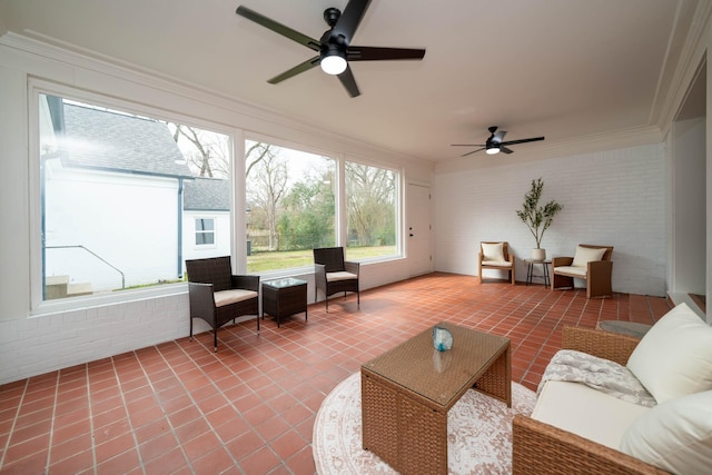 sunroom featuring a ceiling fan