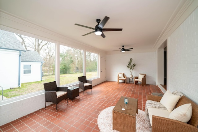 sunroom / solarium with a ceiling fan