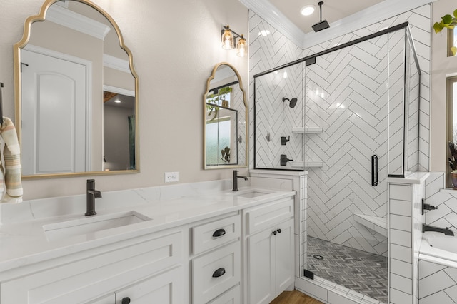 bathroom featuring double vanity, a stall shower, a garden tub, and a sink