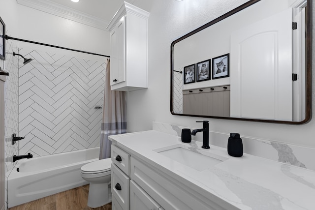 bathroom with shower / tub combo, toilet, ornamental molding, wood finished floors, and vanity