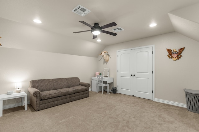 carpeted living room featuring baseboards, visible vents, and vaulted ceiling