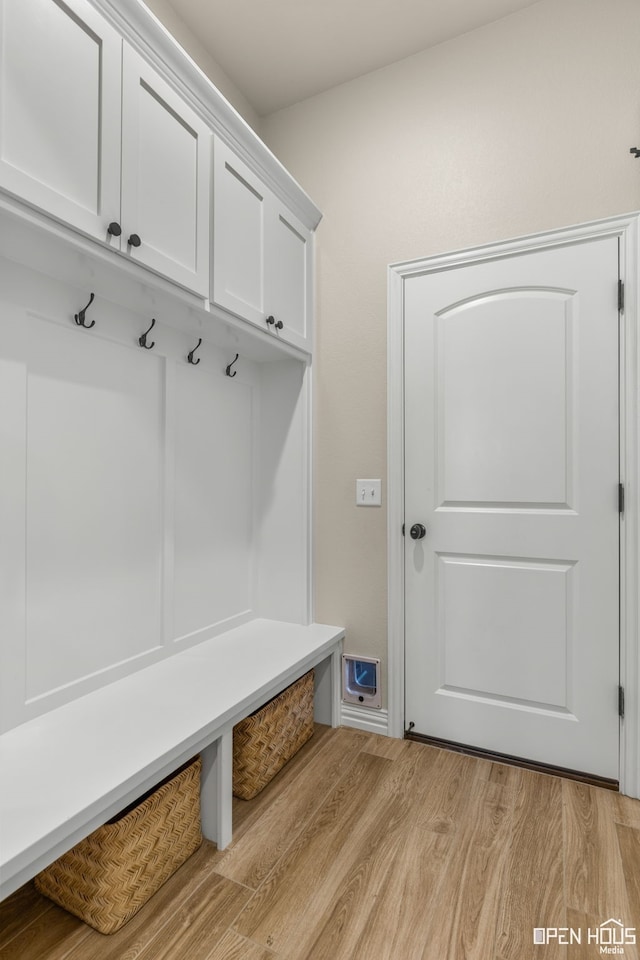 mudroom with light wood-style floors