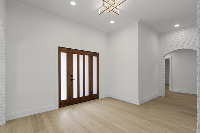 entrance foyer with baseboards, recessed lighting, light wood-type flooring, and crown molding