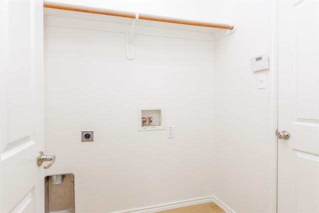 laundry room featuring baseboards, laundry area, washer hookup, and hookup for an electric dryer