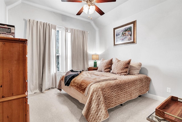 bedroom featuring lofted ceiling, multiple windows, and carpet flooring