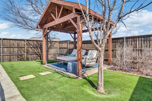 view of yard with a fenced backyard, a patio, and a gazebo