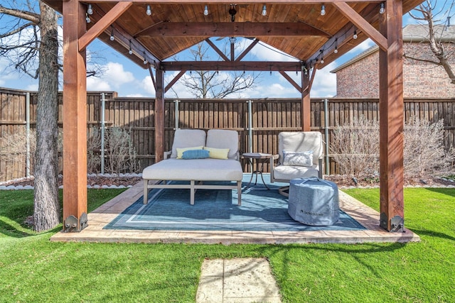 view of patio featuring a fenced backyard and a gazebo