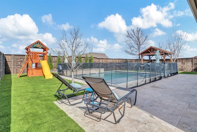 view of pool featuring a fenced backyard, a patio, a fenced in pool, and a yard