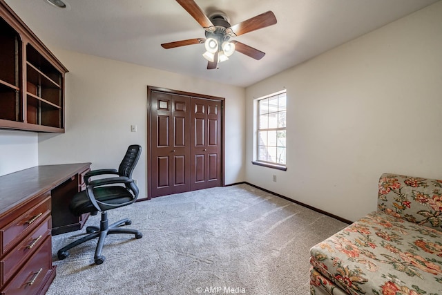 office with carpet, a ceiling fan, and baseboards