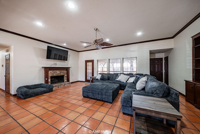 living area with light tile patterned floors, recessed lighting, a ceiling fan, a brick fireplace, and baseboards