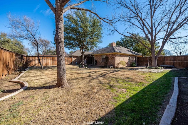 view of yard featuring a fenced backyard