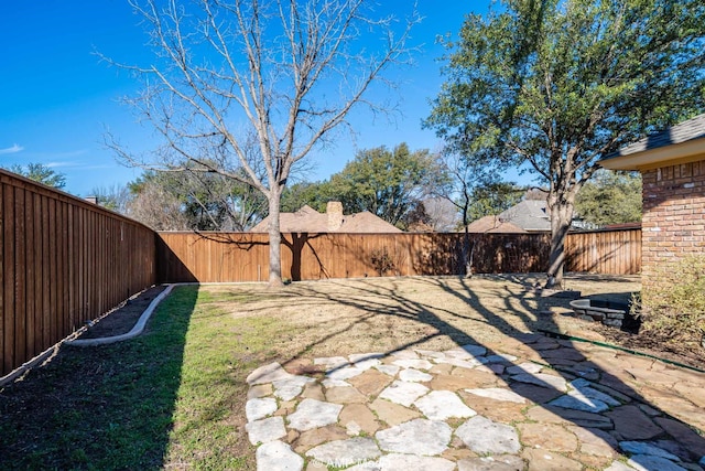 view of yard with a fenced backyard