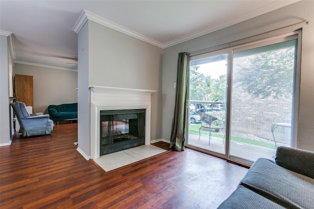 living area featuring ornamental molding, a multi sided fireplace, and wood finished floors