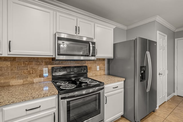 kitchen with crown molding, stainless steel appliances, tasteful backsplash, light tile patterned flooring, and white cabinetry