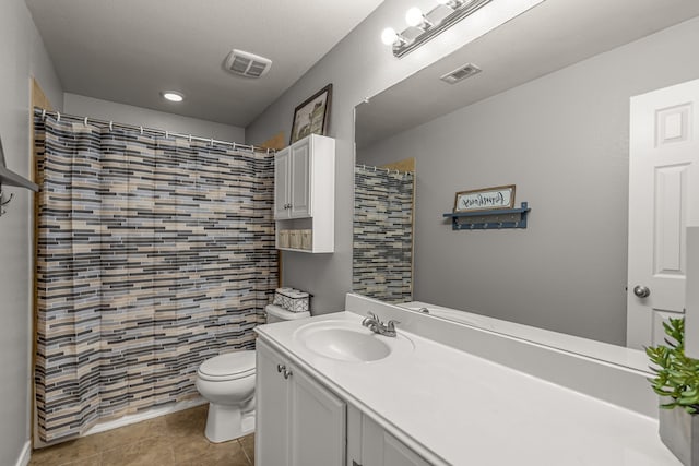 full bathroom featuring toilet, vanity, tile patterned flooring, and visible vents