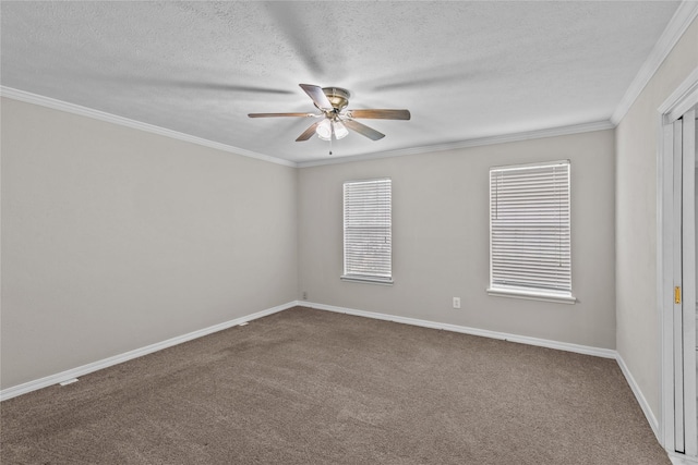 unfurnished room with baseboards, a ceiling fan, crown molding, a textured ceiling, and carpet flooring