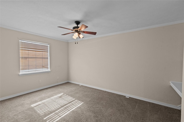 unfurnished room featuring carpet flooring, crown molding, baseboards, and ceiling fan