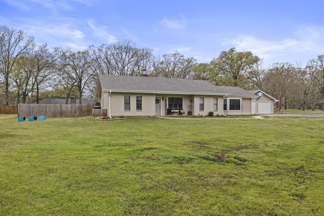 single story home with a garage, a front lawn, central AC unit, and fence