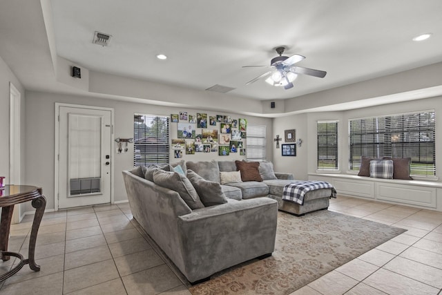 living area featuring light tile patterned floors, ceiling fan, visible vents, and recessed lighting