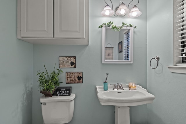 bathroom featuring toilet and a sink