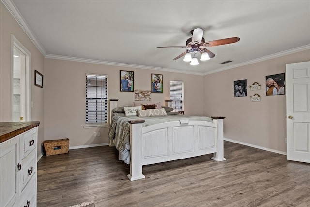 bedroom with crown molding, multiple windows, visible vents, and dark wood-style flooring