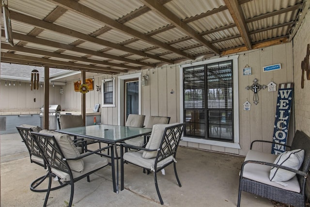 view of patio featuring grilling area and outdoor dining space