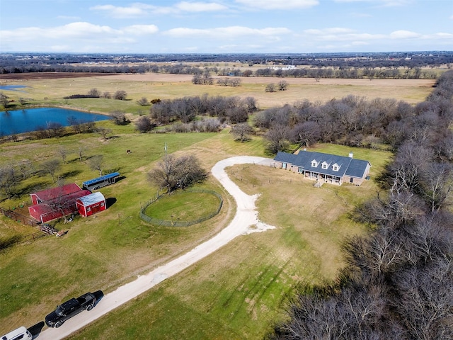 birds eye view of property with a water view and a rural view