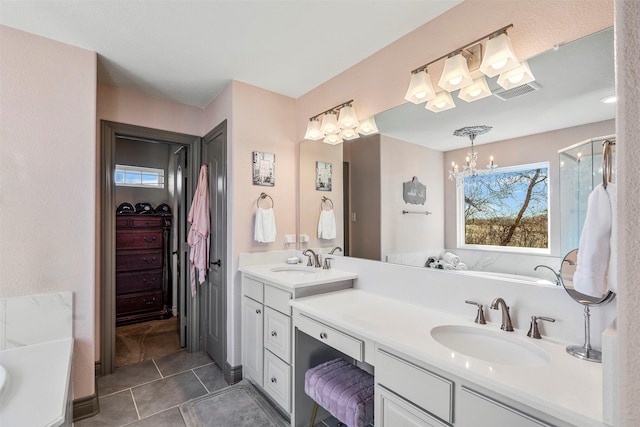 full bathroom with double vanity, a shower stall, a spacious closet, and a sink