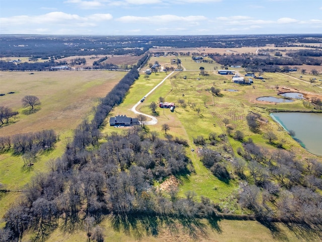 drone / aerial view featuring a water view and a rural view